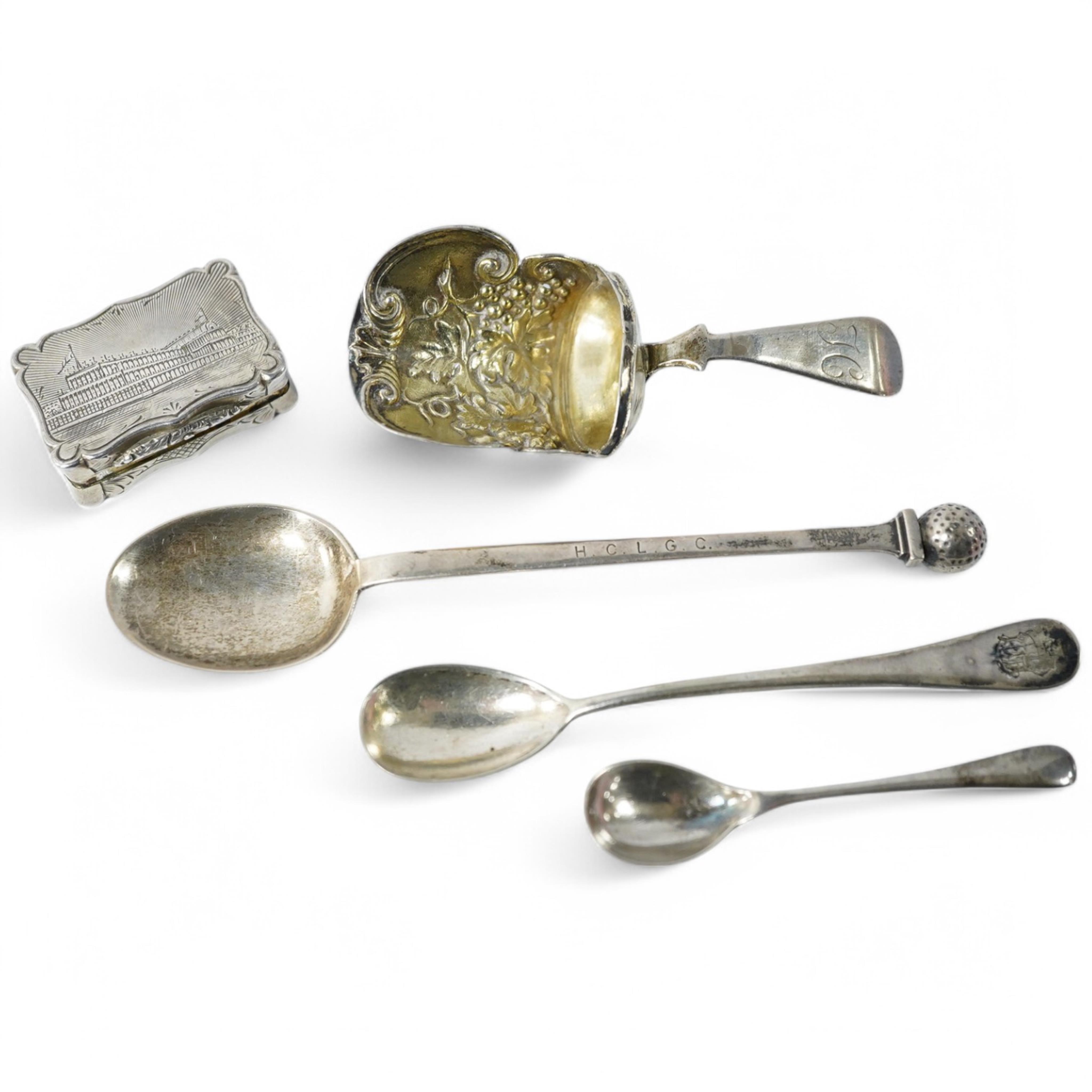 A Victorian silver shaped rectangular vinaigrette, engraved with a scene to commemorate The Great Exhibition at the Crystal Palace in Hyde Park, London, by William Dudley, Birmingham, 1850, 33mm, together with three smal